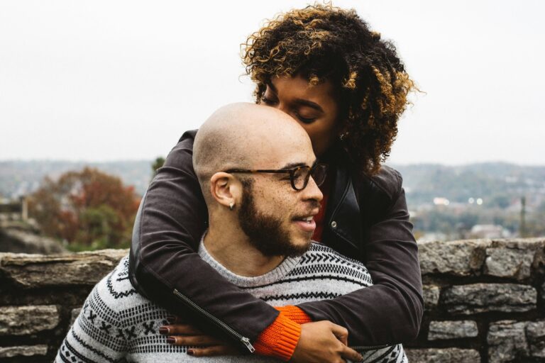 Couple embraces outdoors, sharing a quiet moment of closeness—symbolizing reinvesting in connection when partners feel like roommates