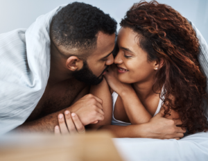 Couple building intimacy through non-sexual touch and skin-to-skin contact in a relationship
