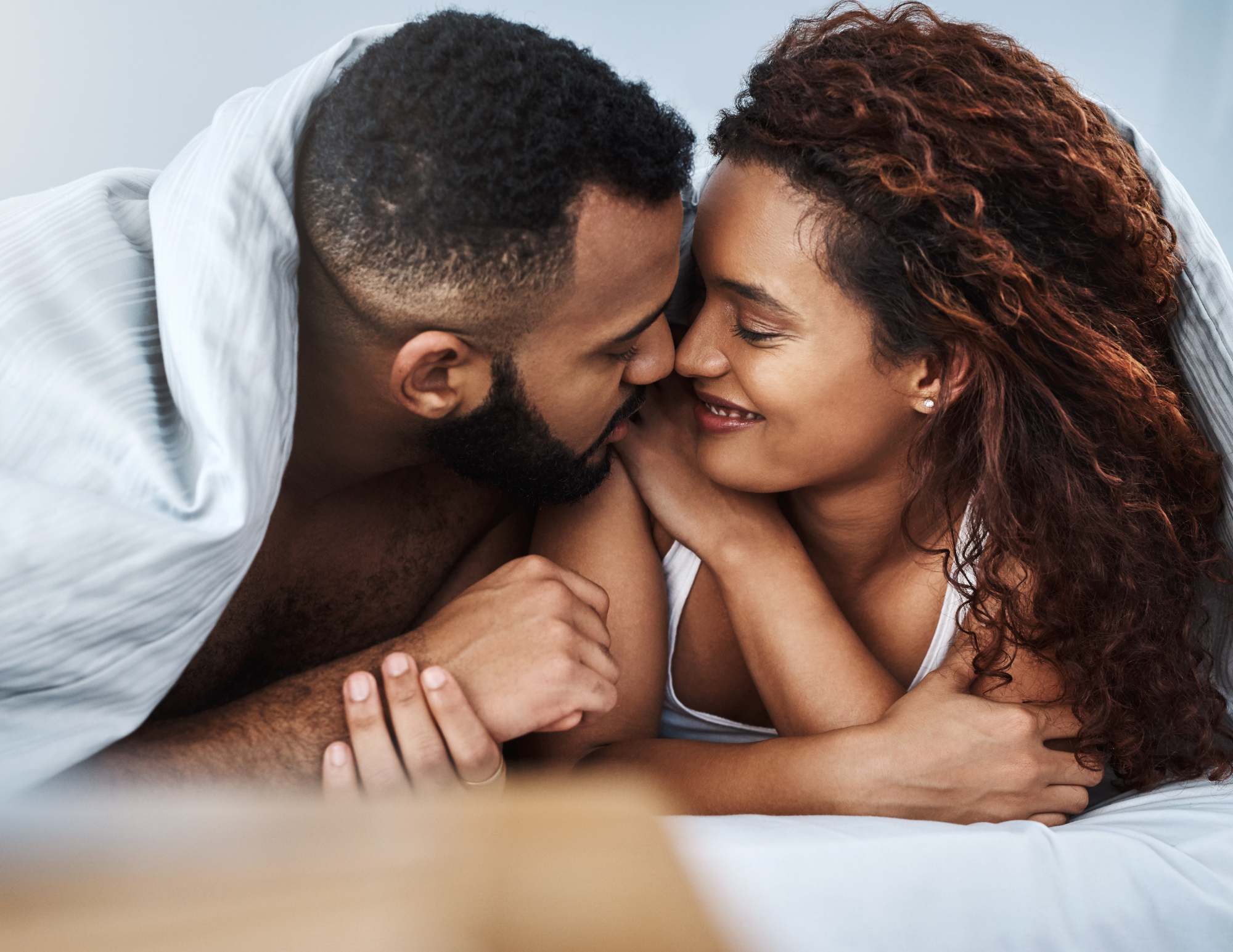Couple building intimacy through non-sexual touch and skin-to-skin contact in a relationship